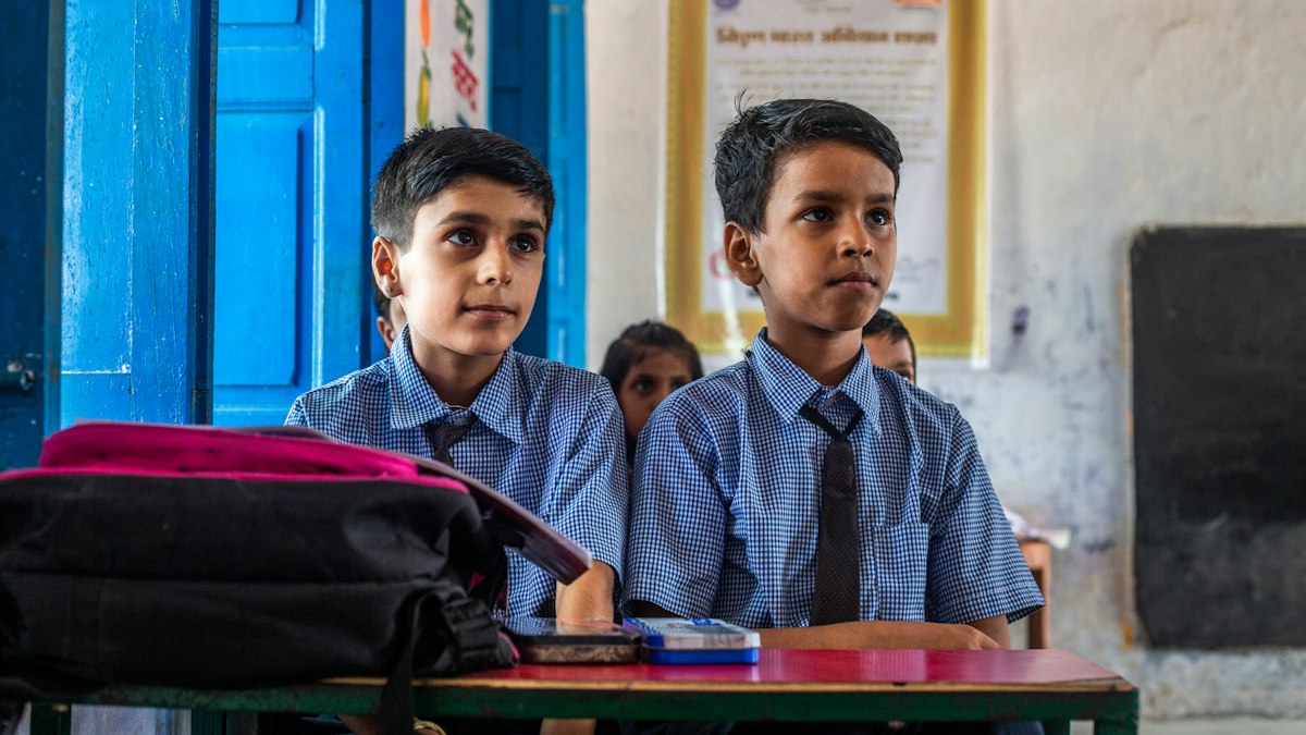 Boys in uniform in class