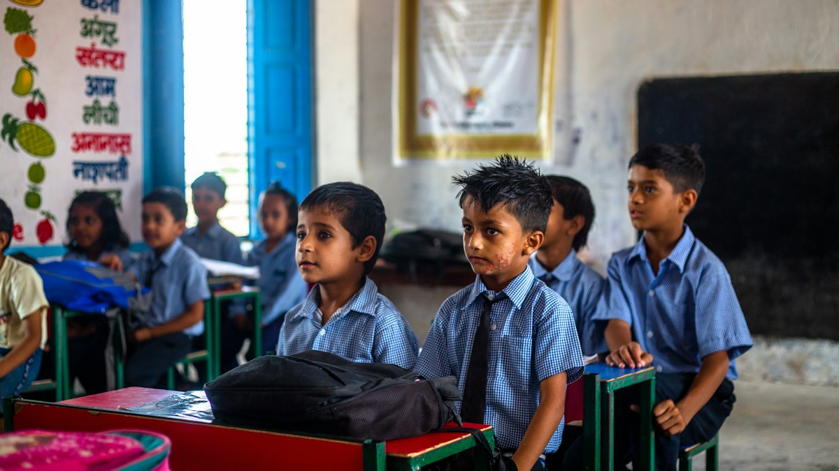 Students in uniform sitting in class