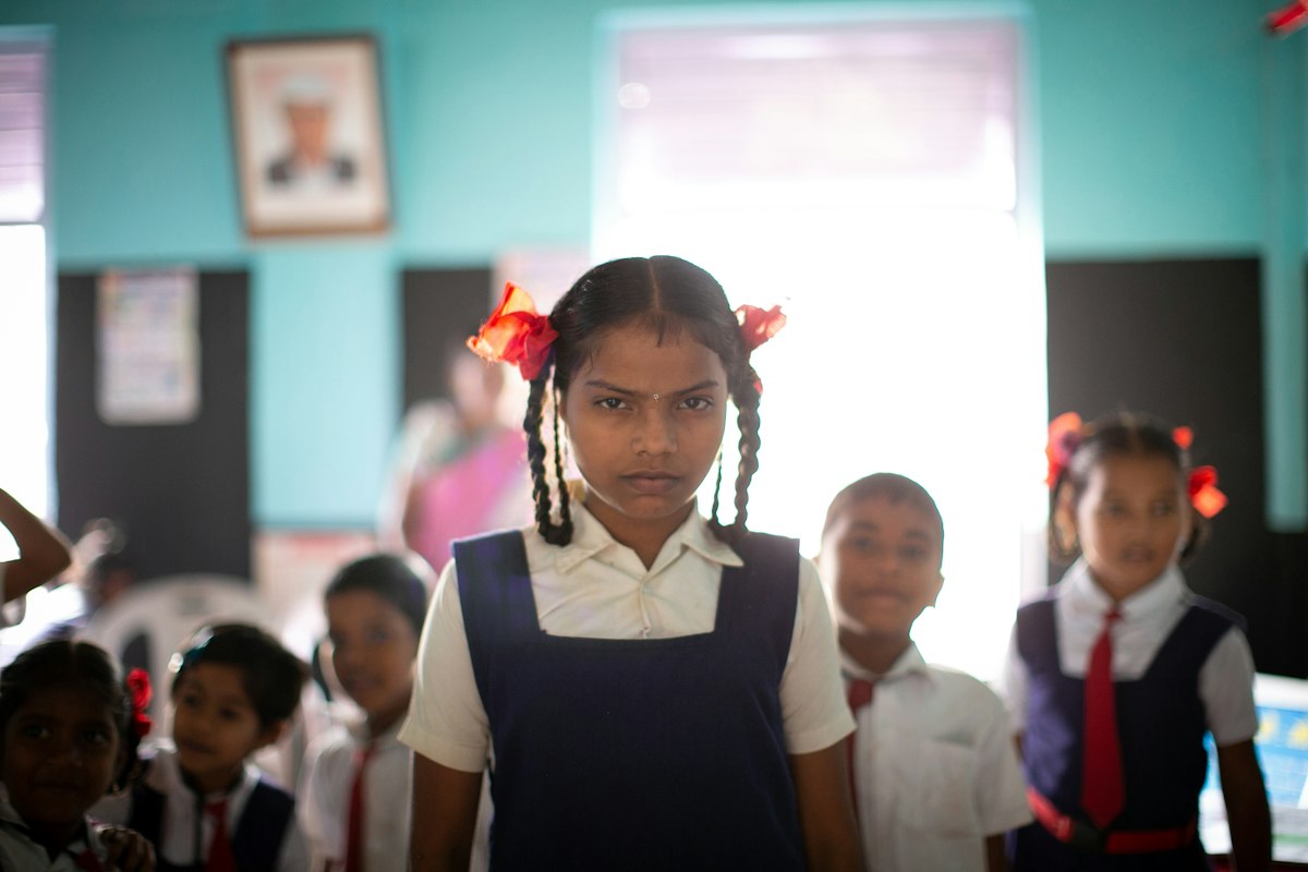Girl in school uniform in class