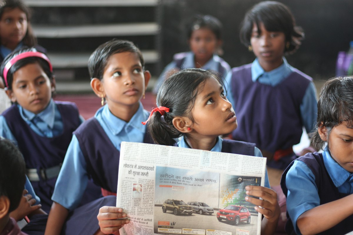 Students reading a newspaper