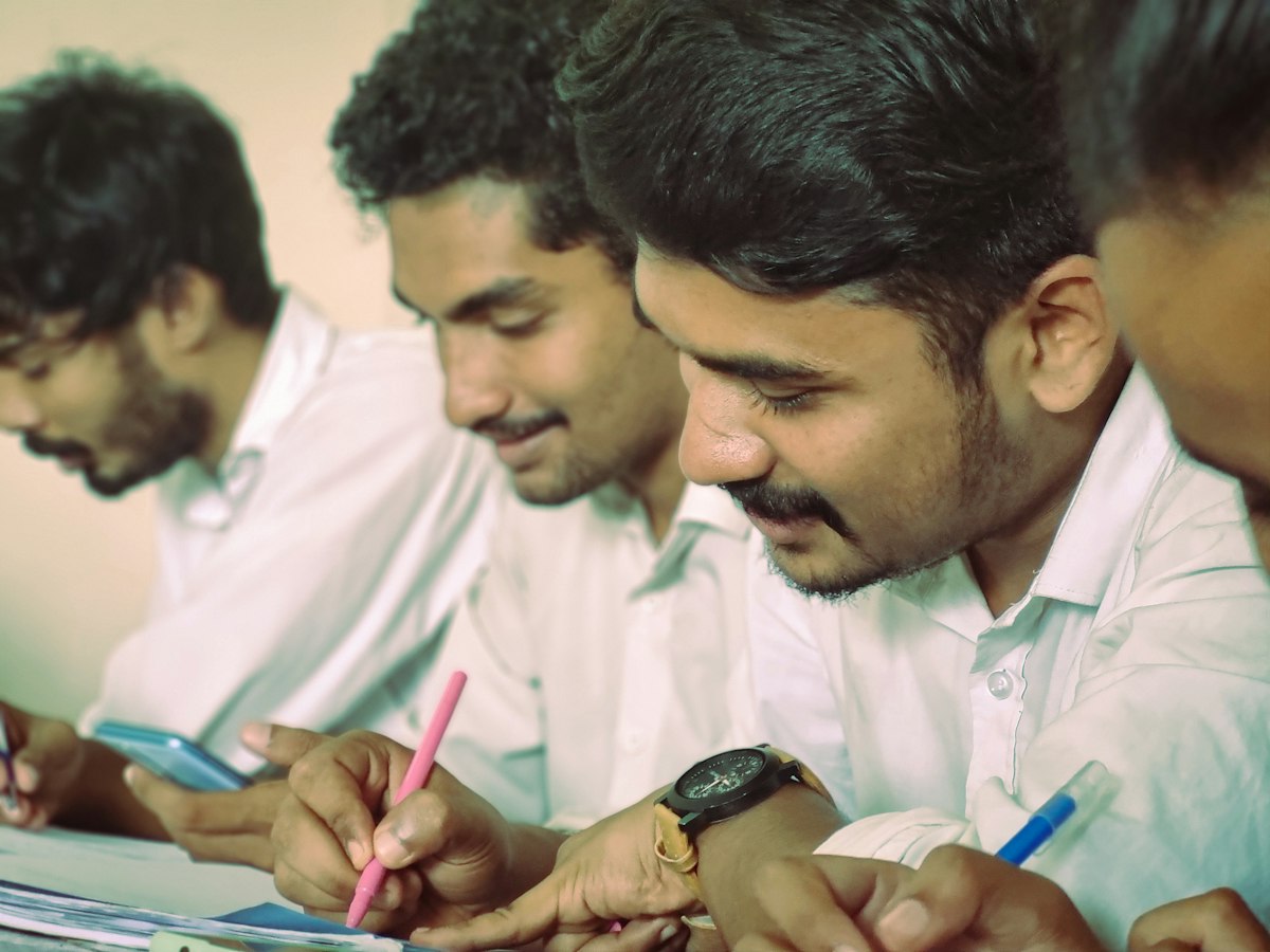 Students writing notes